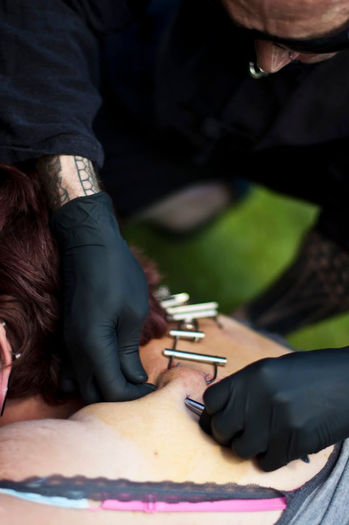A couple of photos of Lou getting her back pierced and the hooks in place. A couple of photos of Lou getting her back pierced and the hooks in place.